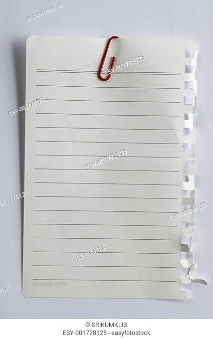Blank note paper and red paper-clip. Isolated with clipping path