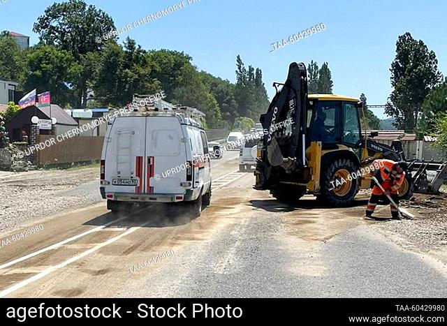 RUSSIA, KRASNODAR REGION - JULY 13, 2023: Cleaning up the A-147 highway after heavy rains. Since the evening of July 11, Tuapse District has seen three months'...