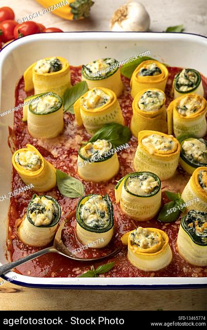 Involtini di zucchini (zucchini rolls with ricotta and spinach in tomato sauce, Italy)