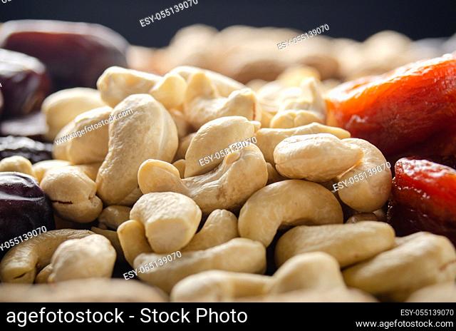 Closeup view at cashew nuts on kitchen table. Vegetarian food concept