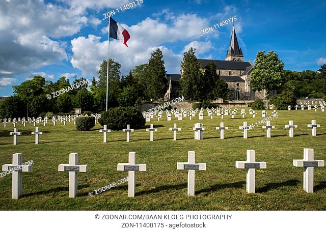Chatillon-sur-Marne, France - June 7, 2017: War cemetery 1914-1918 of French soldiers in Chatillon-sur-Marne with French flag and church