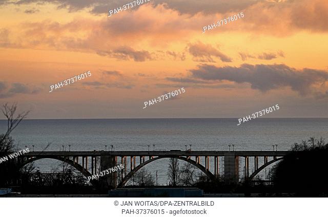 A bridge spans the coastal road M27 along the Black Sea coast at dusk near Sochi, Russia, 5 February 2013. The Winter Olympics are going to take place in the...