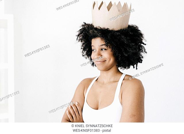 Fit young woman wearing paper crown