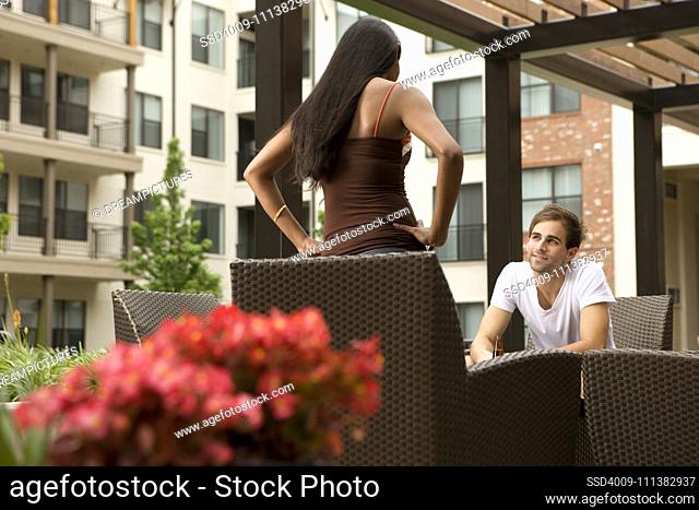 Couple talking on patio