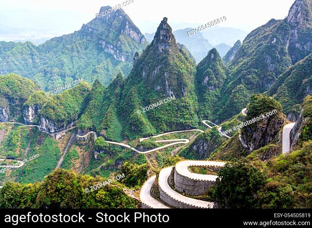 The winding road of Tianmen Mountain with sharp cliffs and green tries, Zhangjiajie National Park, Hunan, China