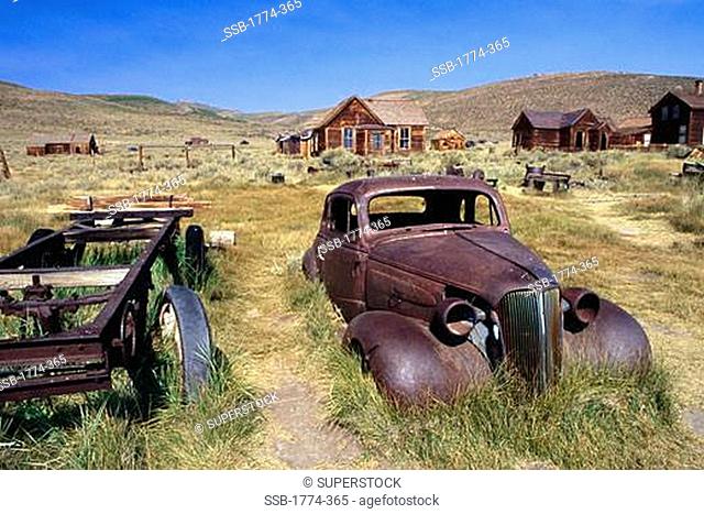 View of Rusting Cars and Mining Equipment, Bodie Ghost Town, California, USA