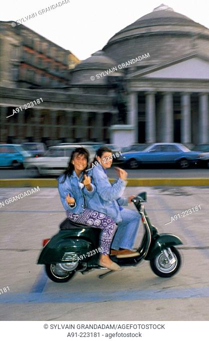 Girls on a moped at Plebiscito Square. Naples. Italy Naples. Italy