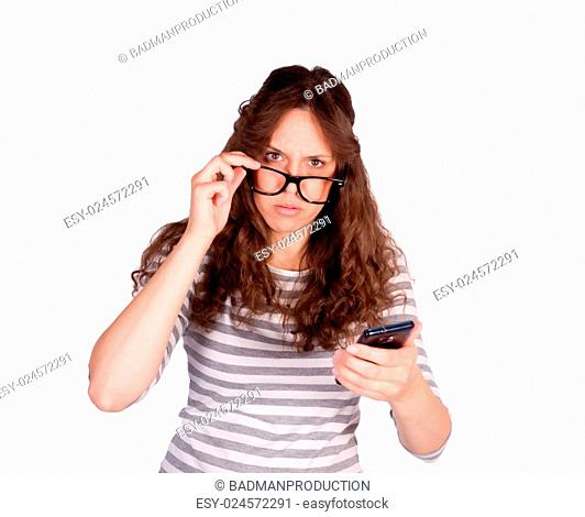 Confused women with cell phone in her hands isolated on white background