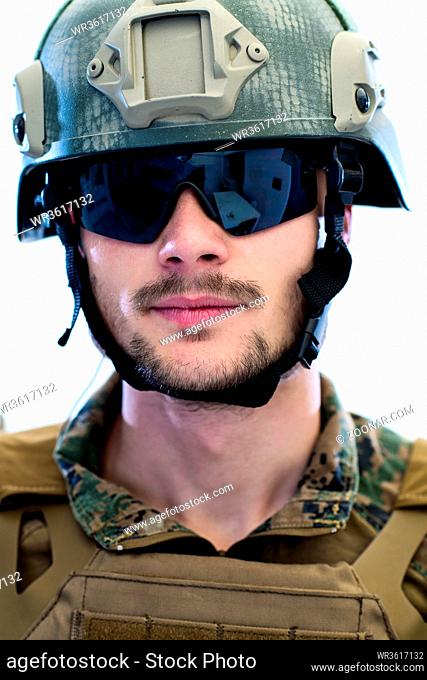 american marine corps special operations modern warfare soldier with fire arm weapon and protective army tactical gear ready for battle