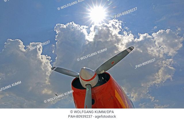 The sun pictured behind a propeller, with outdoor temperatures hovering around 30 degrees Celsius, at the ILA Berlin Air Show in Schoenefeld,  Germany