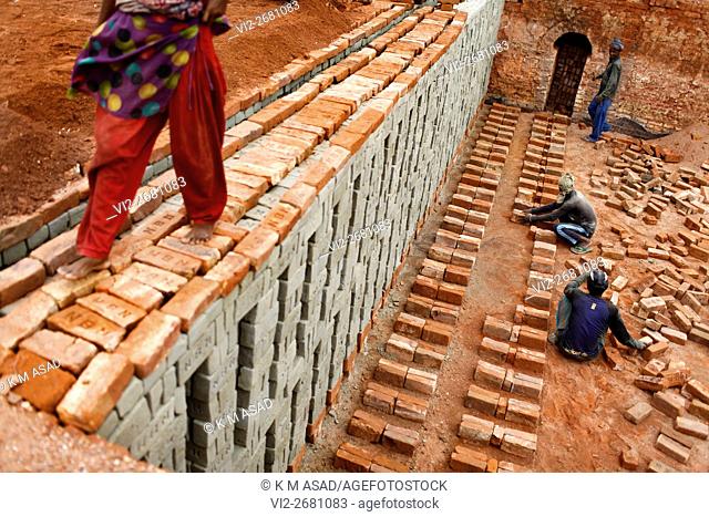 People work at a brick factory in Narayangonj, Bangladesh June 01, 2016. This group of people comes from sunamgonj outside Dhaka