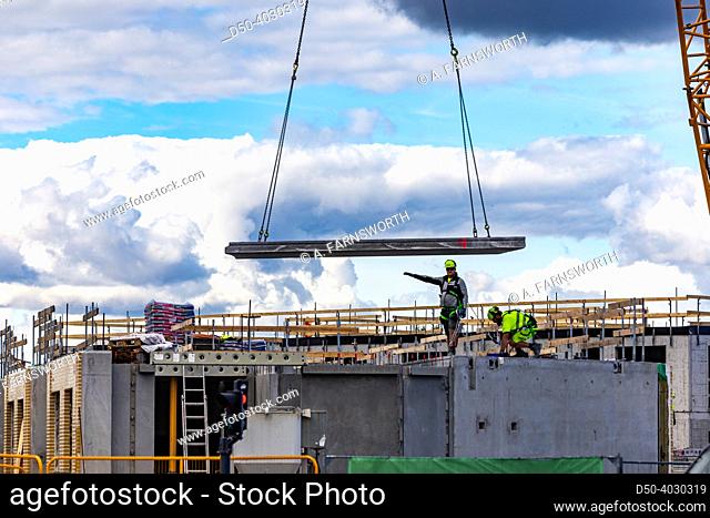 Copenhagen, Denmark Construction workers and a crane in the modern Orestad district