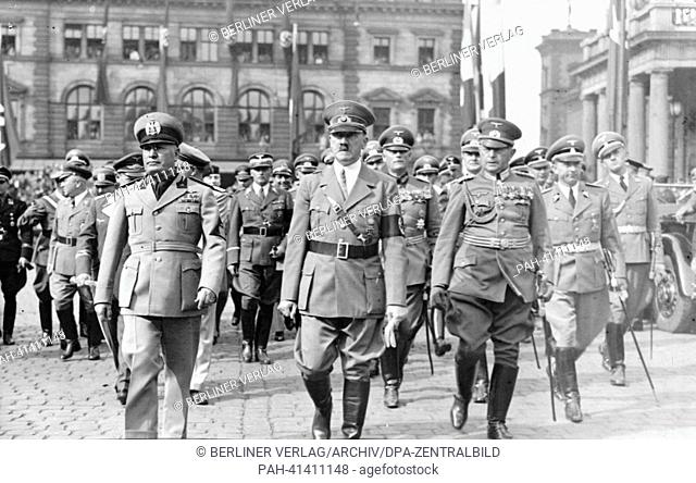 The image from the Nazi Propaganda! shows Adolf Hitler and the Italian Prime Minister Benito Mussolini after his arrival upon leaving Munich Central Station in...