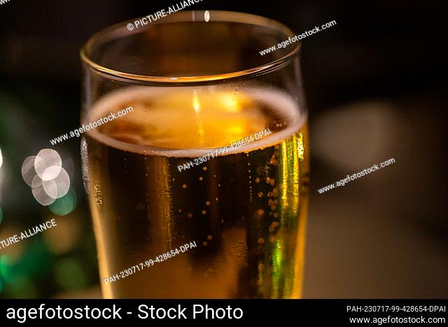 SYMBOL - 15 June 2023, Berlin: A beer glass stands on a table in a bar. Photo: Fernando Gutierrez-Juarez/dpa. - Berlin/Berlin/Germany