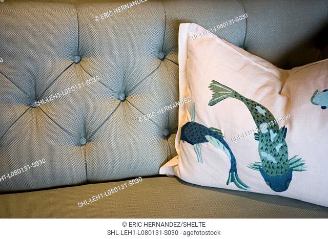 Koi fish throw pillow on sofa