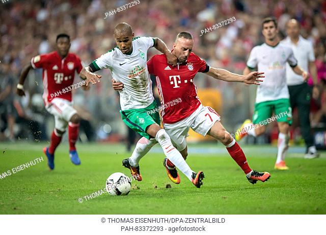 Bayern's Franck Ribery (red) and Bremen's Theodor Gebre Selassie in action during the Bundesliga soccer match between FC Bayern Munich and SV Werder Bremen at...