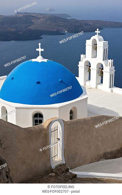 Greece, Cyclades, Thira, Santorini, Bell tower and dome of a church firostefani with aegean sea