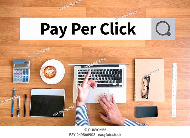PPC - Pay Per Click concept Businessman working with financial reports and a laptop with other objects around, coffee, top view