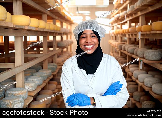 middle eastern black african muslim business woman in local cheese production company