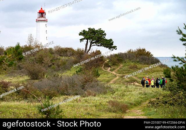 06 October 2023, Mecklenburg-Western Pomerania, Kloster: The lighthouse Dornbusch on the island of Hiddensee. The lighthouse is Hiddensee's landmark and a...