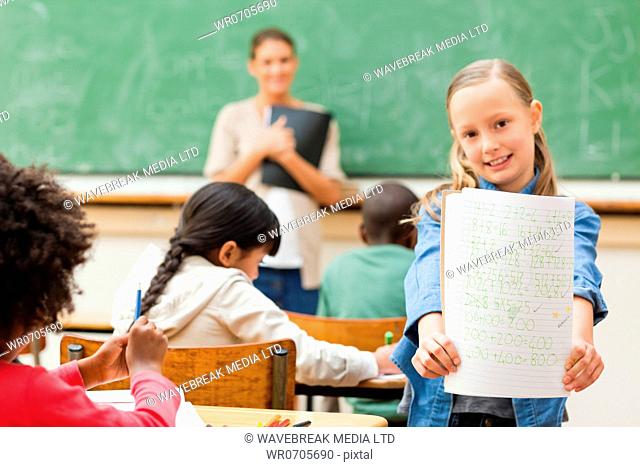 Elementary student showing her results