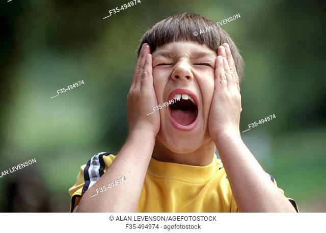 Headshot of boy having a temper tantrum