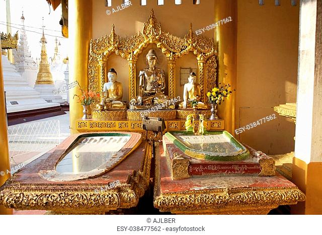 Buddha images at the Shwedagon Pagoda is a gilded stupa located in Yangon, Myanmar. The 99 metres tall pagoda is situated on Singuttare Hill