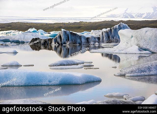 Water reflections in Iceberg in Jokulsarlon glacier lake in Iceland. The icebergs originated from the Vatnajokull float. This location was used for various...