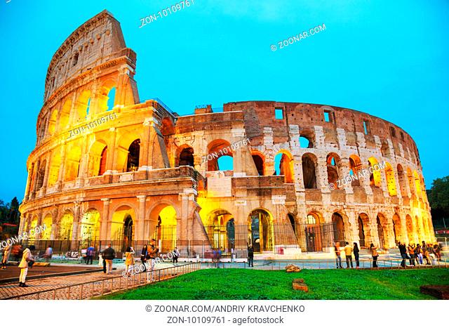 ROME - NOVEMBER 08: The Colosseum or Flavian Amphitheatre with people at night on November 8, 2016 in Rome, Italy