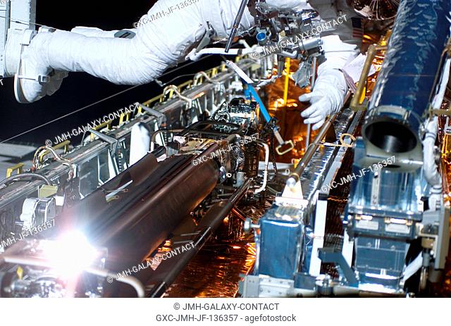 Astronaut Richard M. Linnehan, mission specialist, is about to wrap up the first phase of a seven-hour space walk in the cargo bay of the Space Shuttle Columbia