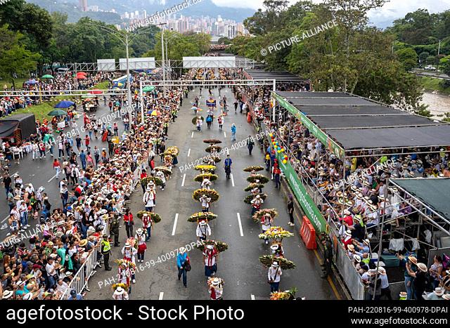 15 August 2022, Colombia, Santa Elena Antioquia: Along the main street of Medellin, silleteros, men, women and children dressed in the typical costumes of the...