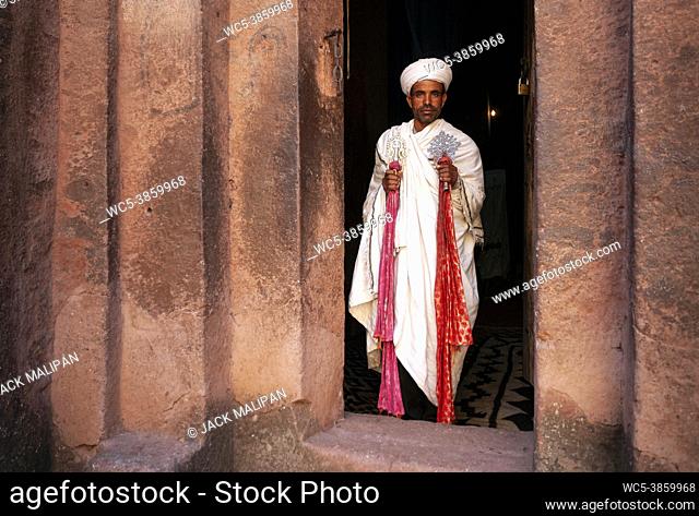 coptic orthodox priest at lalibela ancient rock-hewn monolithic churches landmark UNESCO heritage site in ethiopia