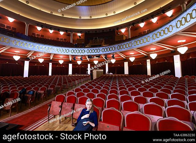 RUSSIA, MOSCOW - OCTOBER 25, 2023: A woman sits in the auditorium of the Moscow Variety Theatre on the day of its reopening after a three-year renovation