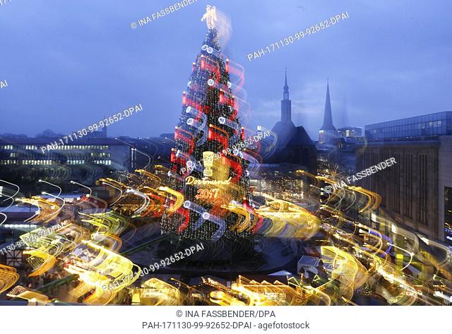 The according to the organisers biggest Christmas tree in the world illuminates the Christmas market in Dortmund, Germany, 30 November 2017