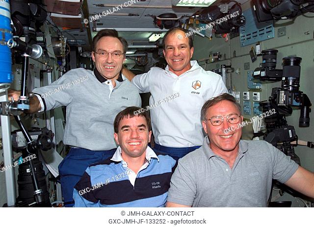 Astronauts Rex J. Walheim (bottom left), Jerry L. Ross, both STS-110 mission specialists, Carl E. Walz (top left) and Michael J