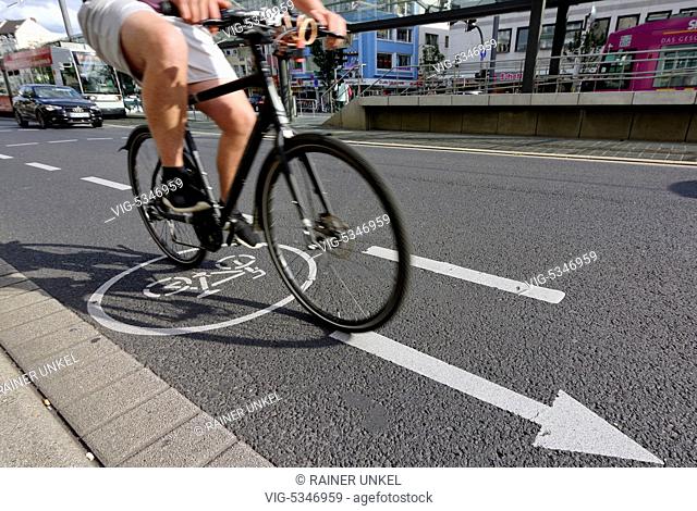 DEU , GERMANY : A cyclist on a bicycle lane , 25.08.2015 - Bonn, Northrhine-Westfalia, Germany, 25/08/2015