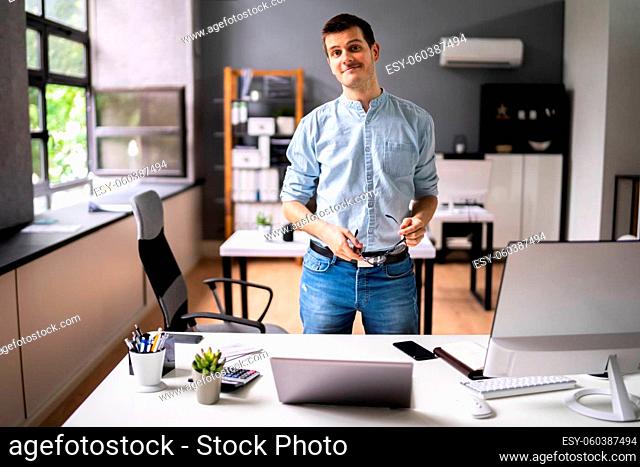 Smiling Entrepreneur Business Person Owner In Office