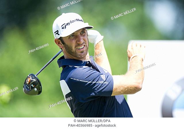 American golf player Dustin Johnson hits the ball at the BMW Open 2013 in Eichenried near Munich,  Germany, 20 June 2013