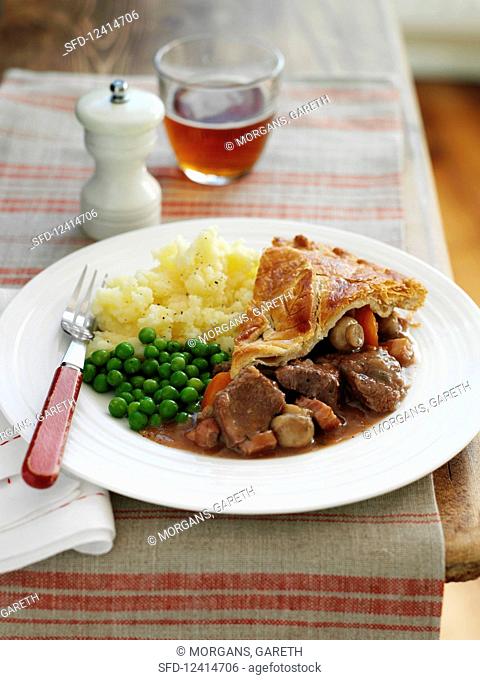 Beef and ale pie with mashed potatoes and peas (England)