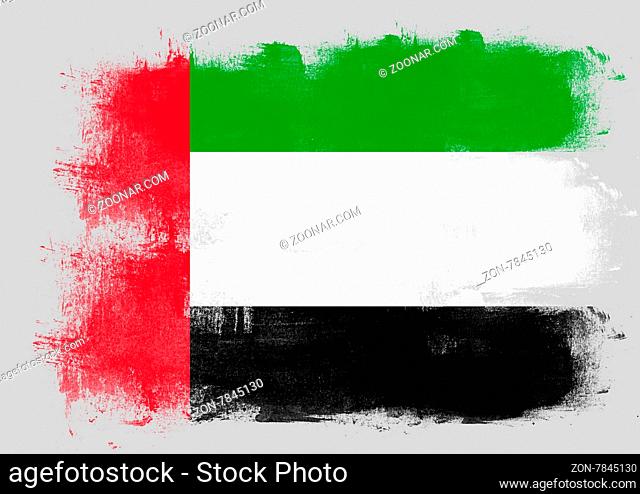 Flag of United Arab Emirates painted with brush on solid background