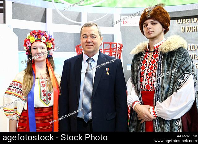 RUSSIA, MOSCOW - DECEMBER 20, 2023: Cosmonaut Oleg Skripochka (C) attends the opening of Zaporozhye Region Day during the Russia Expo international exhibition...
