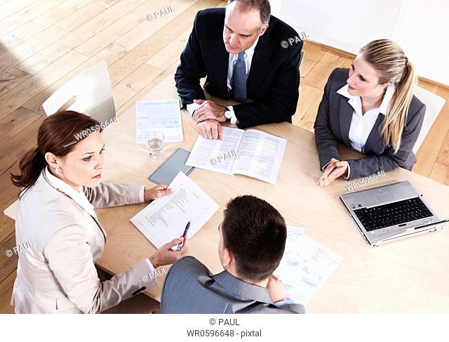 Four businesspeople having a meeting in conference room