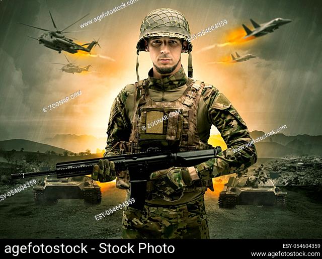 Armed soldier with sniper in the middle of a war