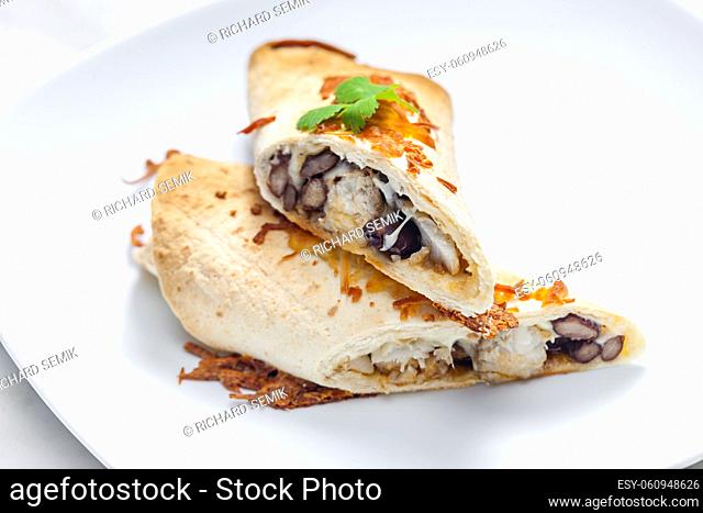 burrito filled with chicken meat and red beans