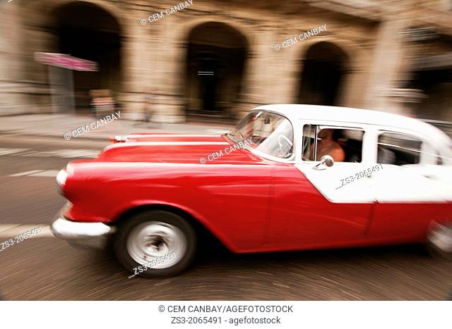 Dynamic scene of an old american car, Prado, Havana, Cuba, West Indies, Central America