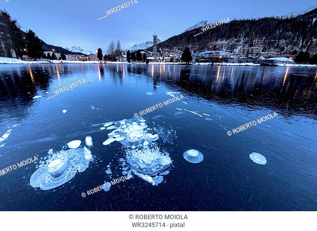 Ice bubbles trapped in the frozen Lake St. Moritz, Engadine, Canton of Graubunden, Switzerland, Europe