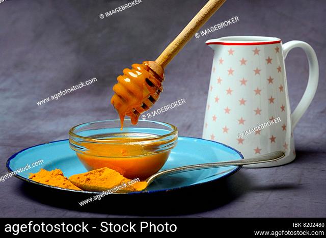 Bee honey with turmeric and turmeric powder, ingredient for Golden Milk, healthy milk drink
