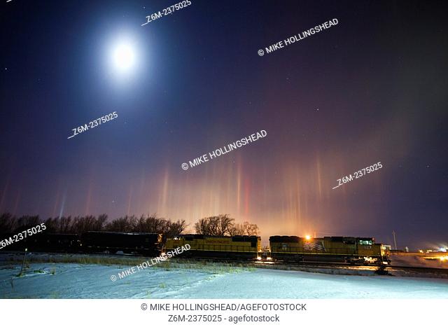 Arctic air combines with river steam and a corn milling plant's steam to produce light pillars over Blair Nebraska, thanks to ice crystals floating in the air...