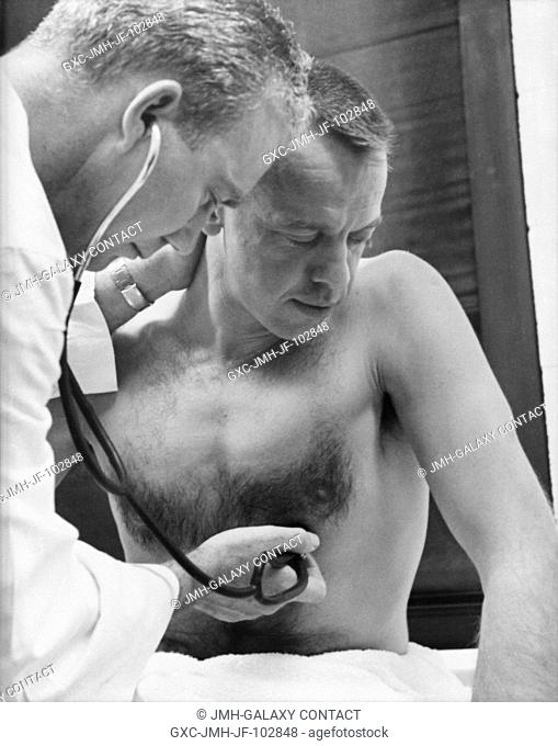 Astronaut Alan B. Shepard Jr. has his heart rate checked prior to his Mercury-Redstone 3 (MR-3) mission, the first American manned suborbital spaceflight