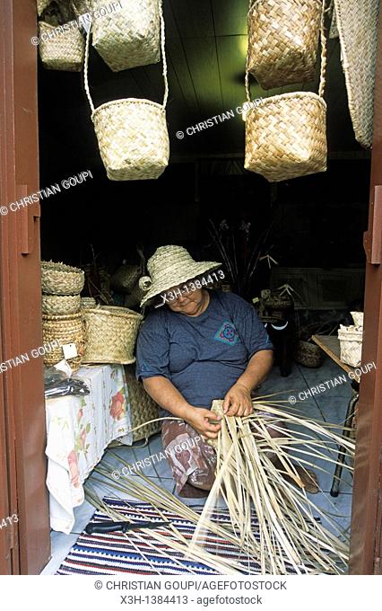 woman making basketworks with Common screwpine's leaves Reunion island, overseas departement of France, Indian Ocean